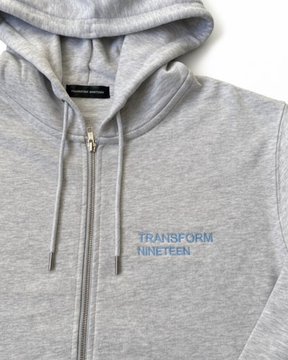 Transform Nineteen – Heather Grey Zip Hoodie (Blue Embroidery)